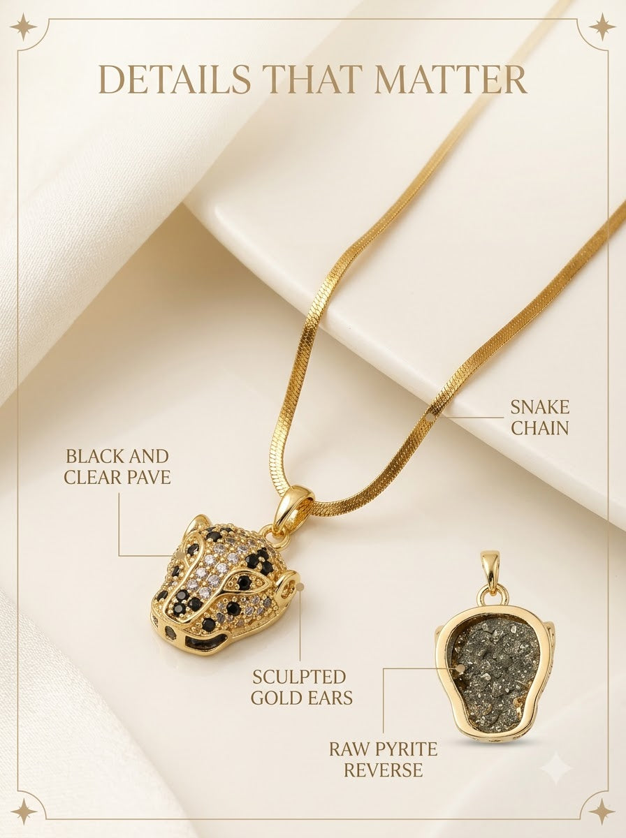 Regalis Panther Pendant detail: black and clear pave, sculpted gold ears, raw pyrite reverse