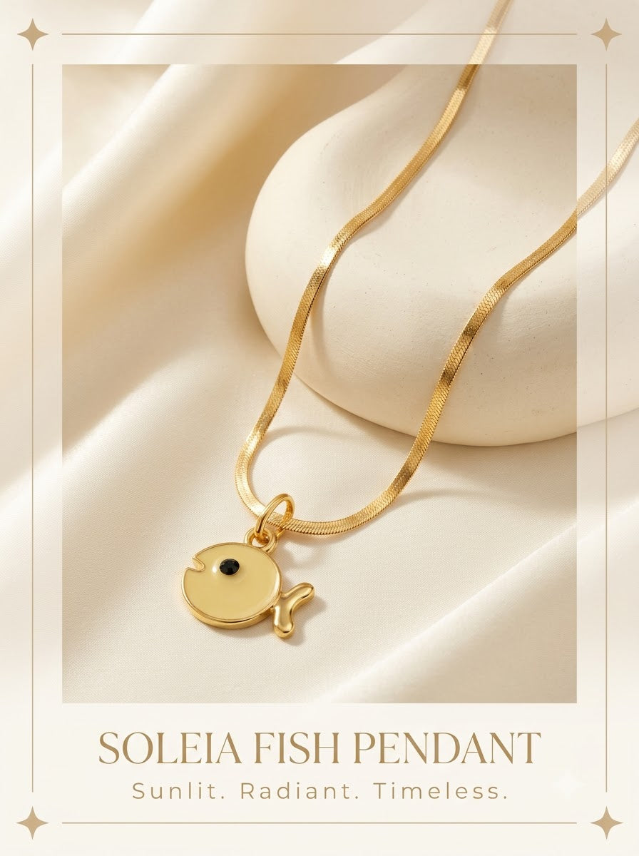 Soleia Fish Pendant yellow enamel fish with gold rim on a herringbone chain