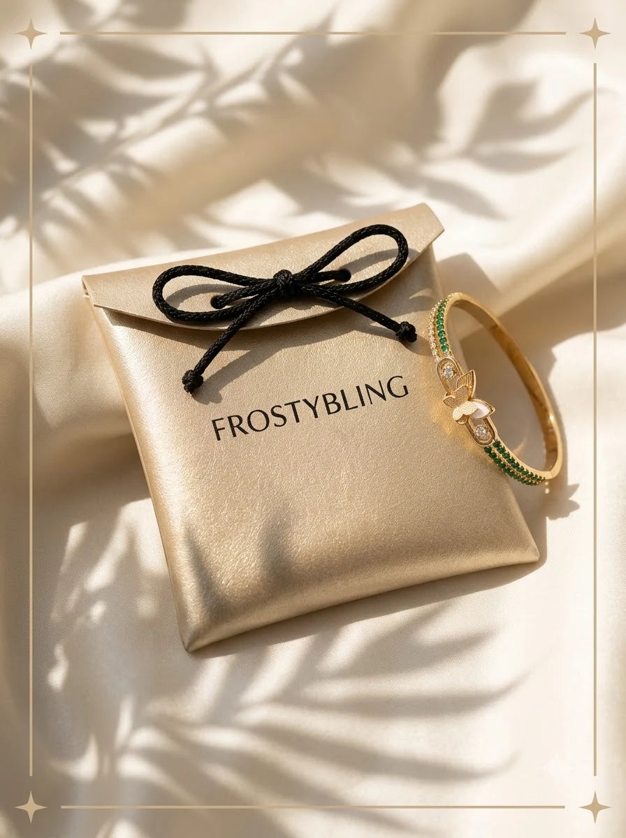 Evanthe Emerald Bangle in the Frosty Bling champagne-gold gift pouch