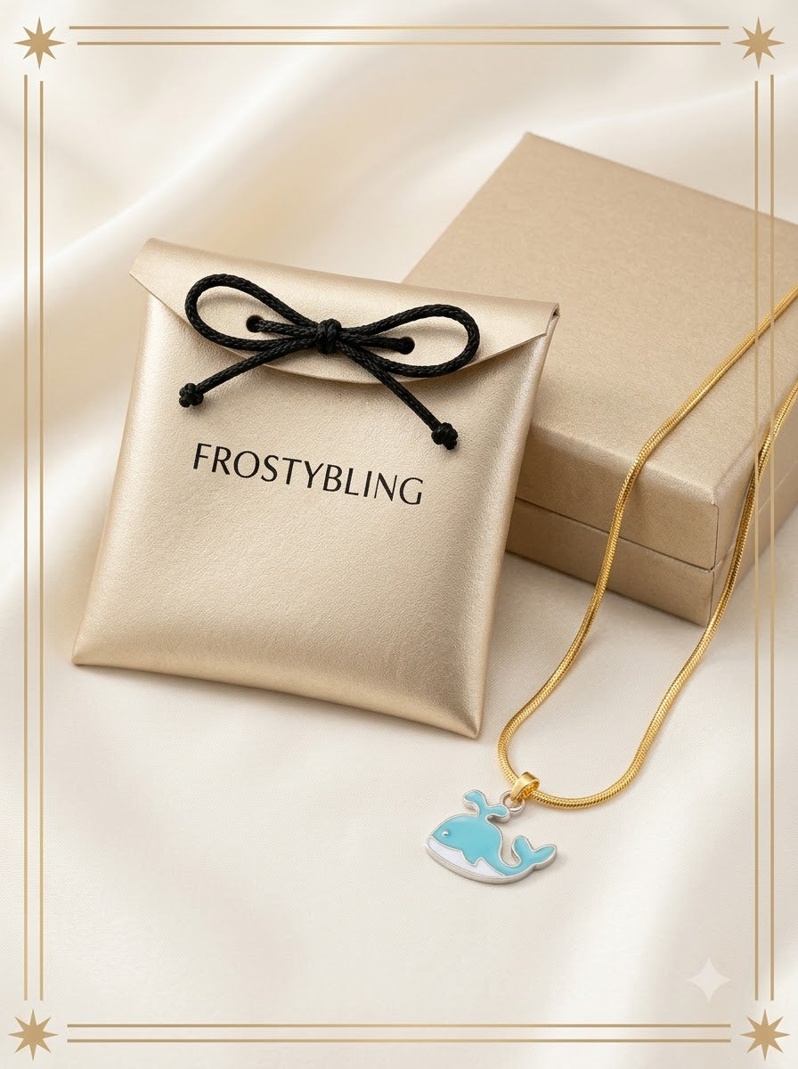 Celimar Whale Pendant in the Frosty Bling champagne-gold gift pouch