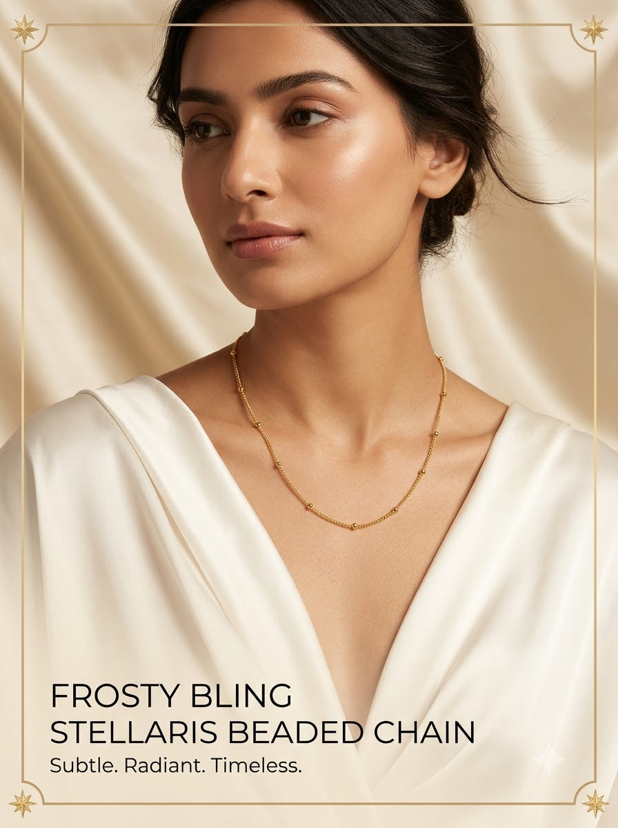 Female model wearing the Stellaris Beaded Chain gold satellite necklace