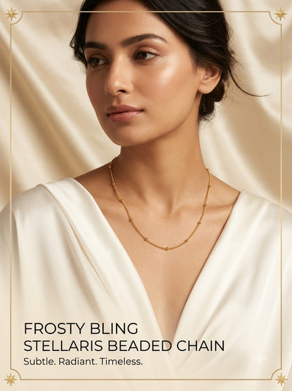 Female model wearing the Stellaris Beaded Chain gold satellite necklace