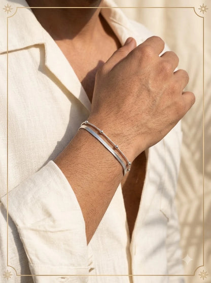 Male model wearing the Thalassa Dual Bracelet on the wrist