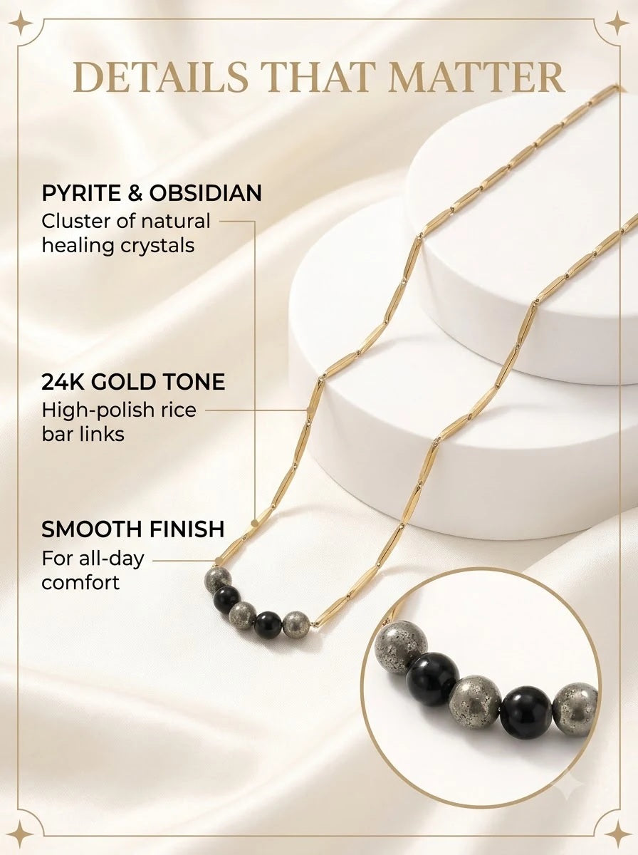 Koros Crystal Chain detail: pyrite and obsidian bead cluster on 24k gold rice bar links