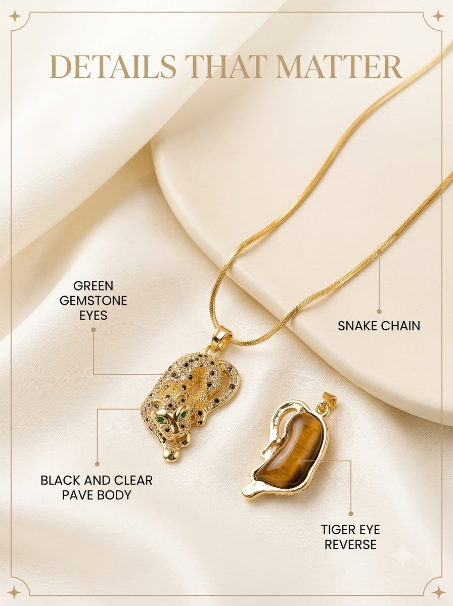 Vyrah Tiger Pendant detail: green gemstone eyes, black and clear pave body, tiger eye reverse