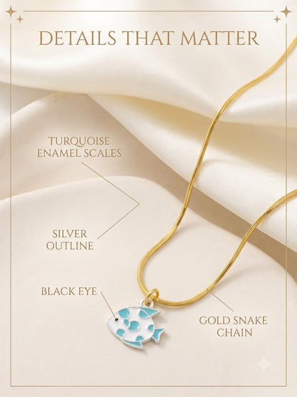 Marisol Fish Pendant detail: turquoise enamel scales, silver outline, black eye and gold snake chain