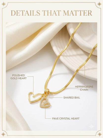 Amoris Twin Heart Pendant detail: polished gold heart, pave crystal heart, shared bail and herringbone chain